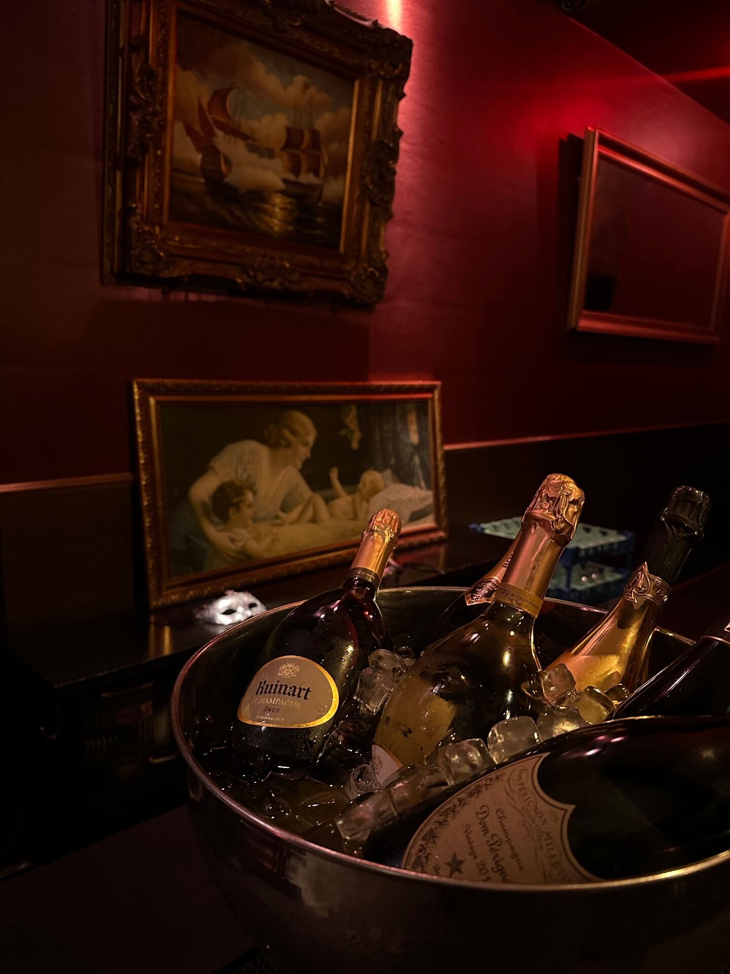 Signature cocktail on a dark marble bar with smoke